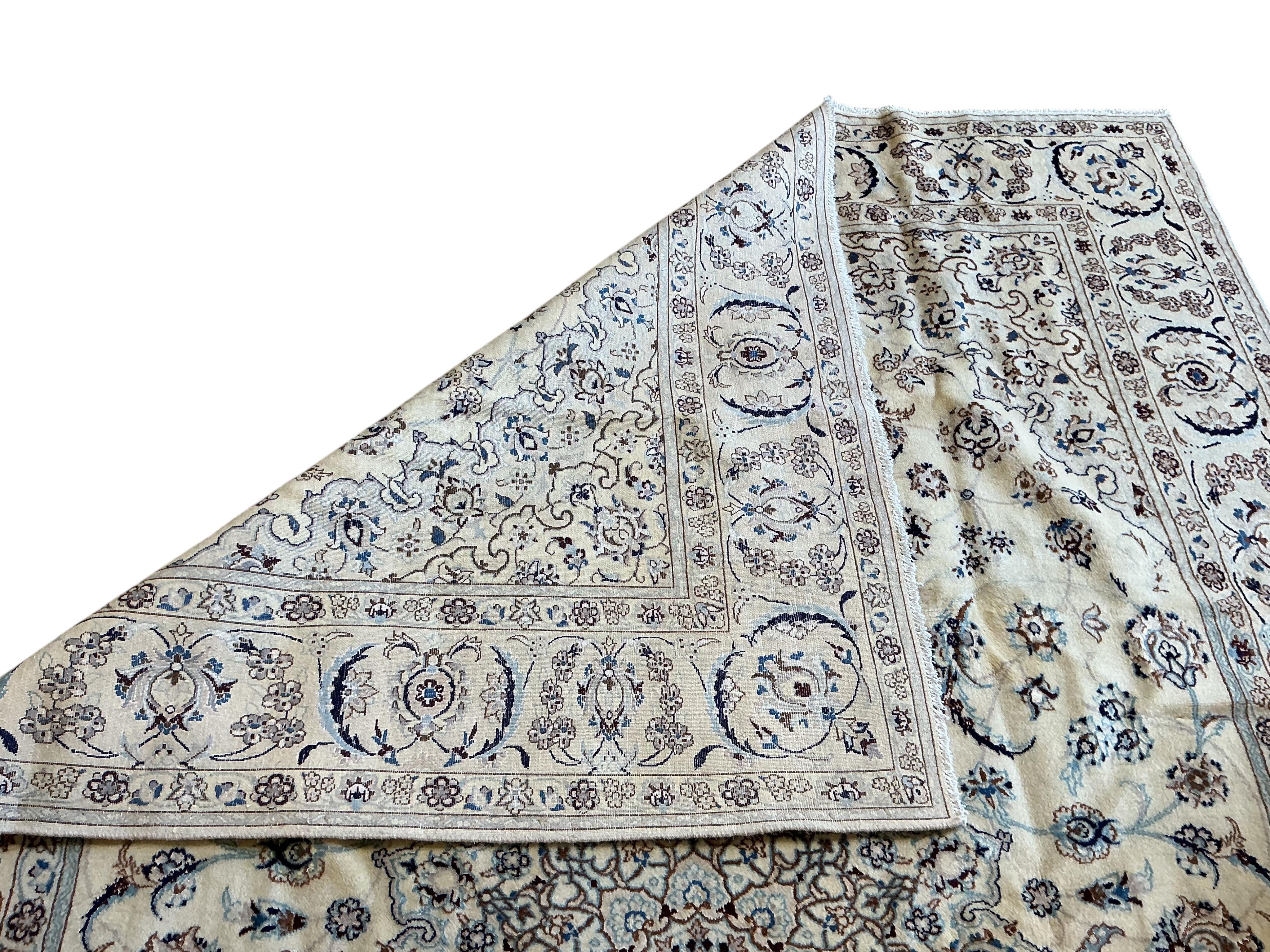 An ivory ground Nain carpet, 300cm x 206cm